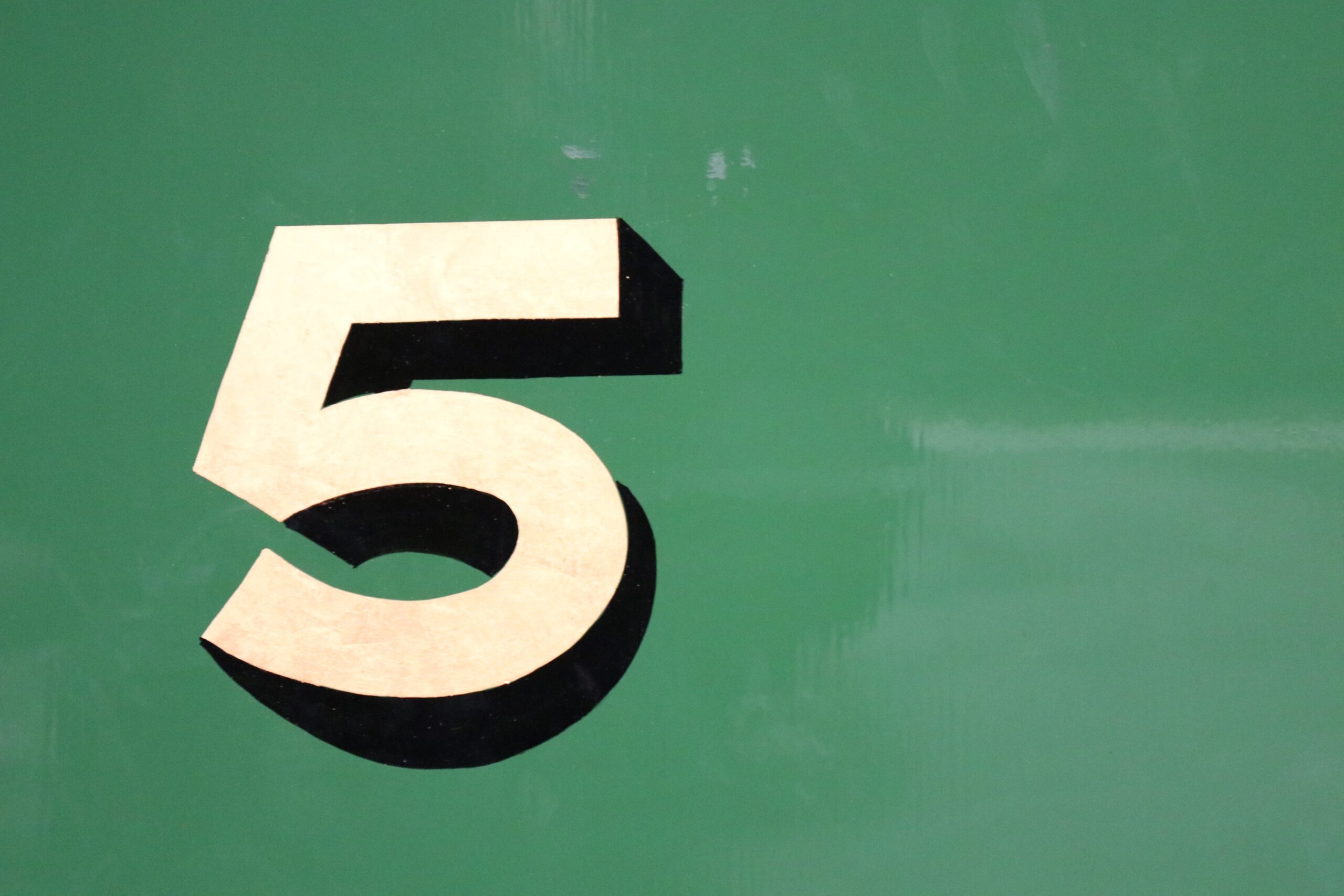 the number 5 on a green background for 5 reasons starting a podcast is still a good idea